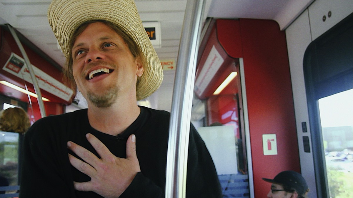 Montgomery telling jokes on a train